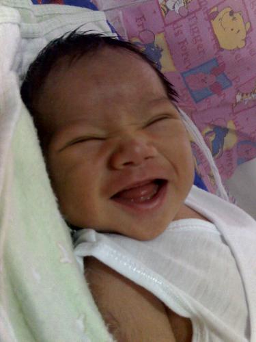 Biggest Smile of a 5 day Old Baby - What can you say he's happy to be in this world.. =P