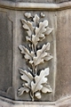 Oak Leaves & Acorns - Have you ever wandered through a cemetery and wondered about the meanings of the designs carved on old gravestones? Thousands of different religious and secular symbols and emblems have adorned tombstones through the ages, indicating attitudes towards death and the hereafter, membership in a fraternal or social organization, or an individual's trade, occupation or even ethnic identity. While many of these tombstone symbols have fairly simple interpretations, it is not always easy to determine their meaning and significance. We were not present when these symbols were carved into the stone and can't claim to know our ancestors' intentions. They may have included a particular symbol for no other reason than because they thought it was pretty.  While we can only speculate what our ancestors were trying to tell us through their choice of tombstone art, these symbols and their interpretations are commonly agreed upon by gravestone scholars.    The mighty oak tree, often represented as oak leaves and acorns, signifies strength, honor, longevity and steadfastness.