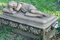Sleeping Child - Have you ever wandered through a cemetery and wondered about the meanings of the designs carved on old gravestones? Thousands of different religious and secular symbols and emblems have adorned tombstones through the ages, indicating attitudes towards death and the hereafter, membership in a fraternal or social organization, or an individual's trade, occupation or even ethnic identity. While many of these tombstone symbols have fairly simple interpretations, it is not always easy to determine their meaning and significance. We were not present when these symbols were carved into the stone and can't claim to know our ancestors' intentions. They may have included a particular symbol for no other reason than because they thought it was pretty.  While we can only speculate what our ancestors were trying to tell us through their choice of tombstone art, these symbols and their interpretations are commonly agreed upon by gravestone scholars.       A sleeping child was often used to signify death during the Victorian era. As expected, it generally decorates the grave of a baby or young child.