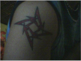 Metallica Tattoo - A tattoo on my right shoulder of the Metallica star symbol.