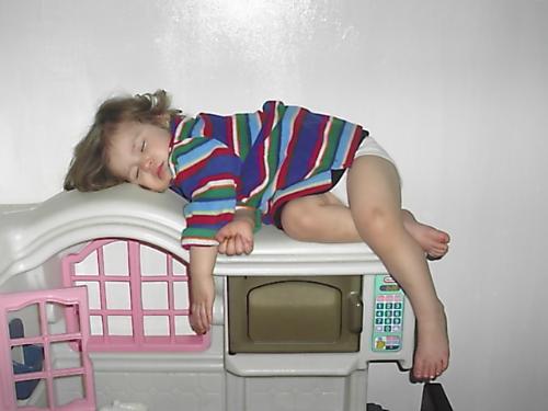 KAT NAPPING - LOL, THIS PICTURE MAKES MY DAY EVERYTIME I LOOK AT IT.  MY YOUNGEST DAUGHTER TOOK A NAP ON TOP OF HER LITTLE TIKES KITCHEN THAT SHE LOVES TO PLAY WITH SO MUCH....HER NAME IS KATIE .....SO WE NAMED IT KATIE KAT NAPPING!!  TELL ME WHAT YOU THINK.