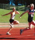 Running - Picture shows two men reaching the finish line after running.