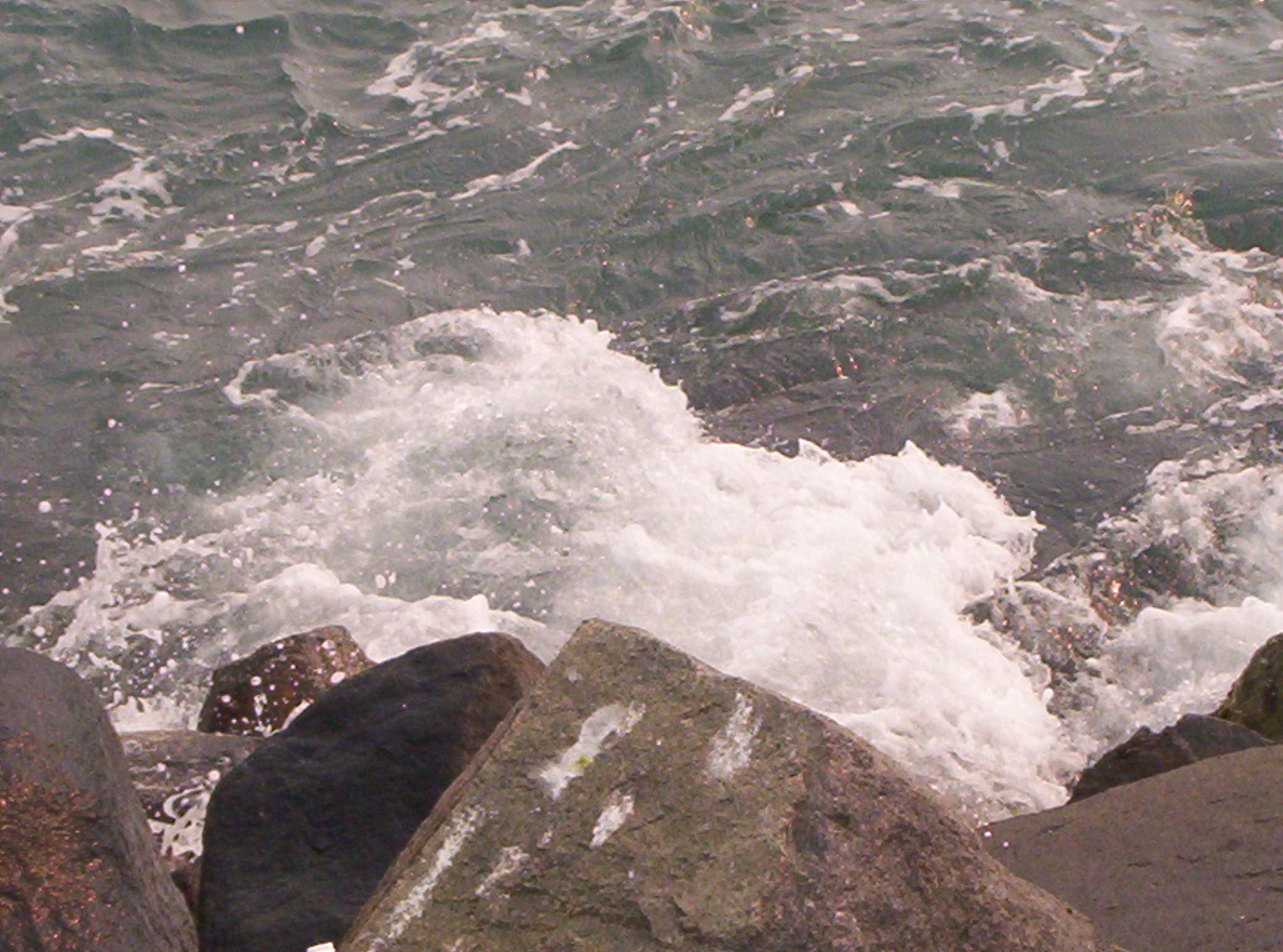 ocean hitting the rocks - i thought this was so cool whe the waves crashed onto the rocks . in southern cali