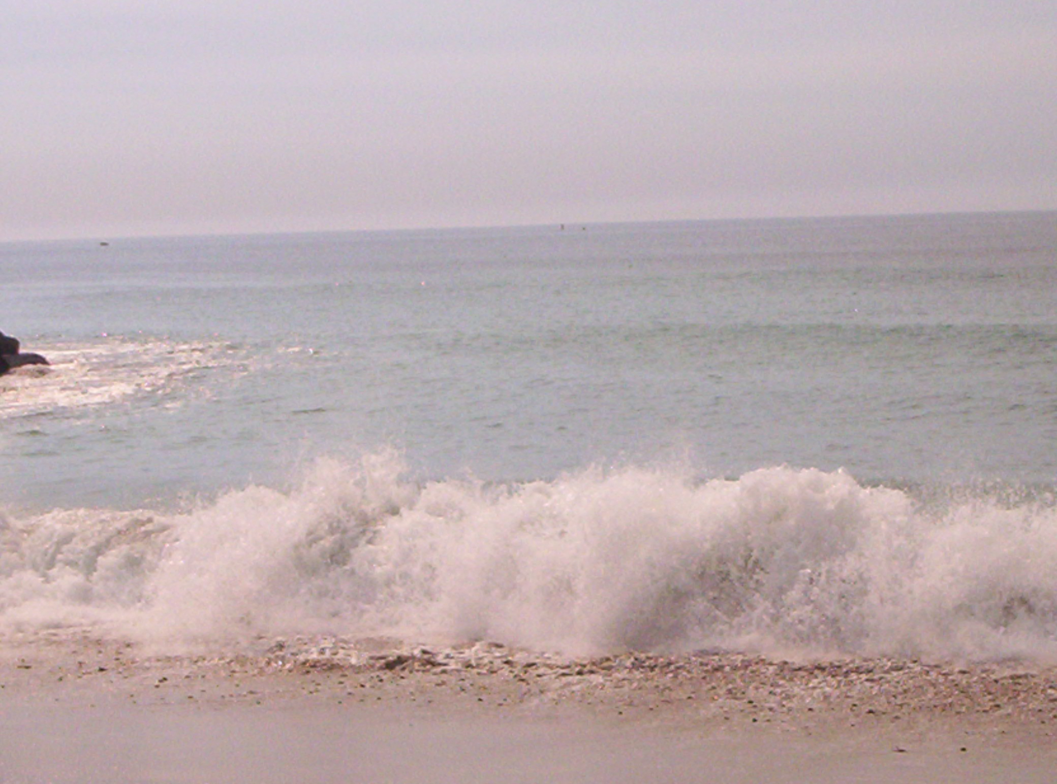 waves crashing - the waves crashing on the beach in cali. it was so relaxing.
