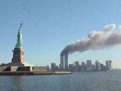 WTC on 9/11 - A picture of the Statue of Liberty with the WTC on fire in the background on 9/11/01.