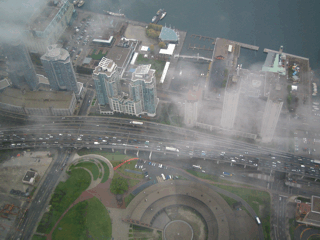 CN Tower, Toronto, Canada (Looking out a window). - Looking down from the CN Tower through a window.