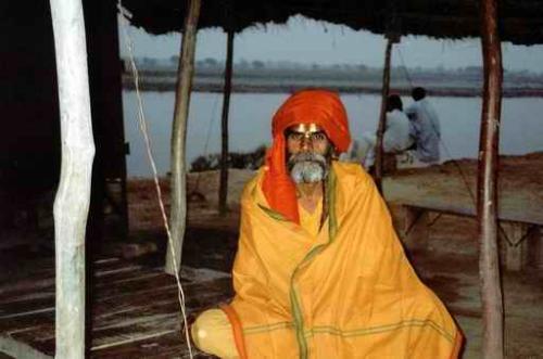An Indian Sadhu (holy man) - This is a typical photo of an indian 'sadhu' or 'swami ji' or 'ascetic'. He represents Hinduism, as can be seen from the saffron cloth round his head, and vermillion and ash marks on his forehead. These are religious colors in Hinduism.