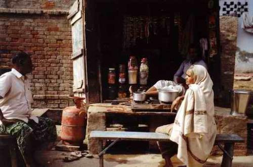 Indian 'Tea Stall' or 'Chai' shop. - This is a photo of a typical 'chai' shop in north india. The whole country abounds in such tea shops that sell junk foods along with tea. The 'chai' shop is the only livelihood for millions of lower class people.