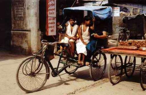 The Indian Rickshaw - This is a photo of the Indian 'Rickshaw' -  the only means of livelihood and sustenance for many low class, poor Indians. In many villages, towns and some cities, rickshaws are still being drawn by many poor. Millions depend on this transportation as their only livelihood. There is no insurance cover. Many rickshaw pullers succumb to alcohol. This transportation is slowly, but suresly fading away, giving way to the auto-rickshaw.