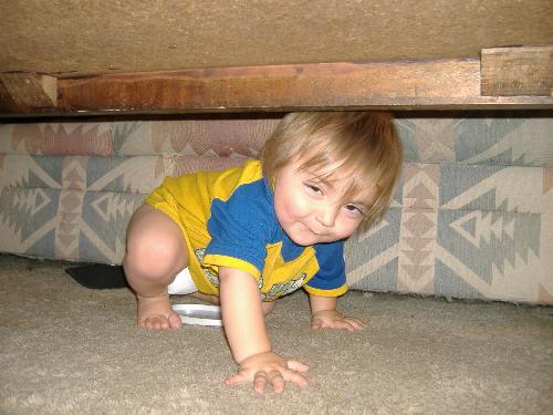 My baby - My Son playing under the coffee table
