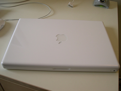 Apple Mac & MacBook pt. 12 - Picture of the mac book closed laying on the desk.m