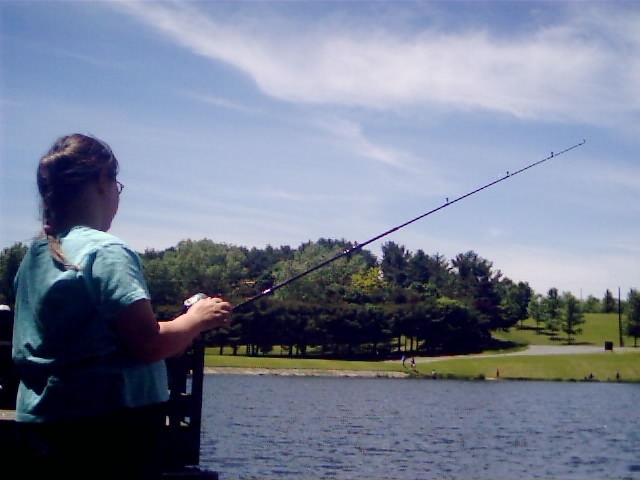 My daughter at the Lake - This is my daughter relaxing with a day of fishing.