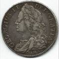 One Shilling - a shilling is worth or was worth one twentieth of a pound, 5 new pence, or 12 old pence prior to 1971