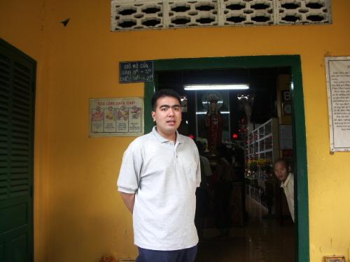 Buddhist Shrine - This is the entrance of a buddhist shrine in Vietnam, you can see the monks inside praying behind me.  =)