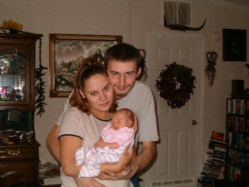 my husband and I with Serena - This was in January 2004 6 days after serena was Born..
