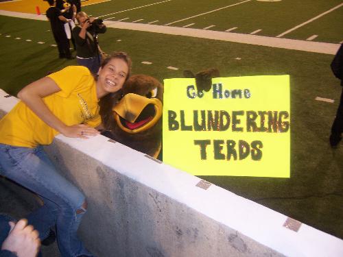 USM - This is a picture of me, my alma mater's mascot, and a sign I made for a recent football game!  The sign was a taunt at our opposing team, Marshall and the Thundering Herd.  You can understand the funny little play on words from the sign and it was quite a hit!  The football game was nationally televised and I got on tv 4 times!!