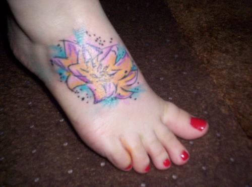 Tattoo, first phase - My tattoo when I got it a year ago. It's of a lotus flower that holds a lot of person meaning for me. Since then I've had some koi added to it and it's grown up my leg a bit.