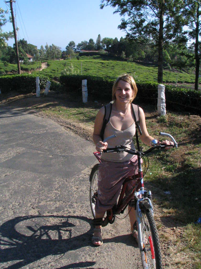kerala - a toursit enjoying the scenic beauty of kerala ..on her bycycle