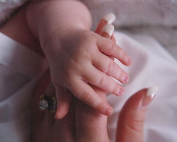 Tender Touches - The sweet tender bond between mama and baby