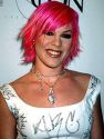 pink - It is difficult to say which came first, Pink's clever name, or the color of her hair. Regardless of which inspired which, the rock star's glowing neon-pink locks, in combination with her youthful rock & roll sounds, make her name impossible to forget. Pink was born Alecia Moore on September 8, 1979, in Doylestown, PA. She was raised in nearby Philadelphia, where she broke into the music scene at an age defying the laws of curfew, and had released her first solo album (Can't Take Me Home) by the age of 19, in the spring of 2000. Her successful pop music career led to her performance of the song 'Lady Marmalade' in the film Moulin Rouge starring Nicole Kidman in 2001. Pink made several television appearances on the MTV Music Awards, and released a performance video, Pink: Most Girls/There You Go, in 2000. In 2002, she appeared in the feature film Rollerball, an action-fantasy film starring Chris Klein, LL Cool J, and Rebecca Romijn-Stamos. Pink's second album, M!ssundaztood, came out just prior to the film's release.