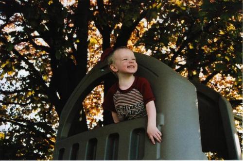 My best picture - This was taken in April-May 2006 in my backyard. My son was 2 1/2 at the time and he's playing on his swingset under our tree.
