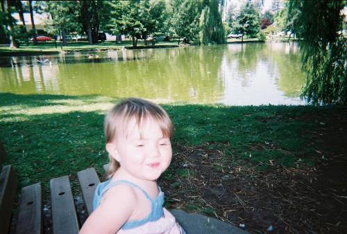 Granddaughter - My granddaughter sitting on a park bench