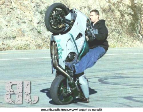 Stuntman - a man on a bike perfoming a stunt