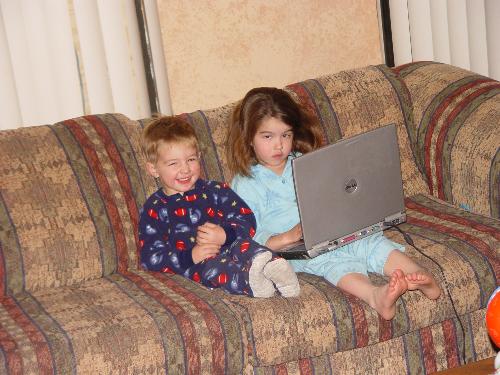 children - my daughter and son playing on there dad laptop