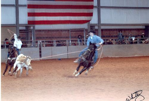 Nephew in Rodeo in TX - My nephew and his cousin in a calf roping contest at a rodeo in Texas. They did good that day.