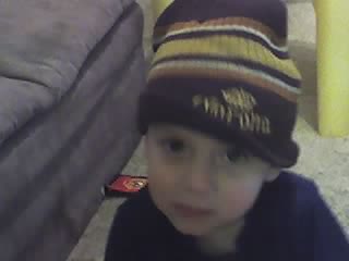 My first son - My son is laying down reading and playing on the floor so i decide to take his pic.