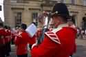 Bands - Bands on street with members in red.