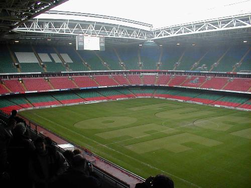 get the message thru - Message on the grass in a soccer stadium.