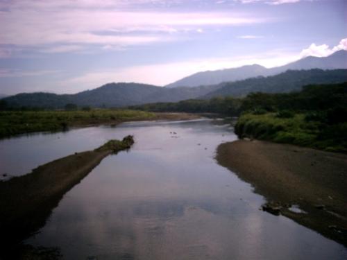 River running into the Sea - This is where a river runs into the Pacific Ocean in Costa Rica, the land of 'Pura Vida'.