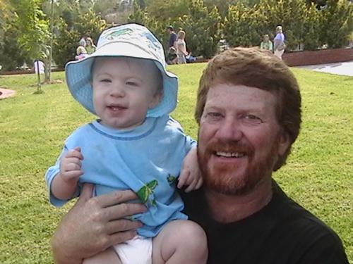 My daddy and Logan - This is a photo taken at Celebration City. My dad and Logan enjoying the sunshine.