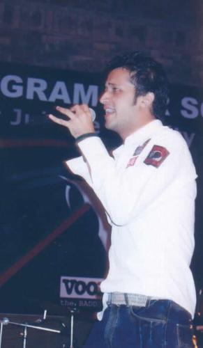 atif aslam pic 27 - Atif attended high School at PAF College Lahore, where he played Cricket and became interested in music. He attended PICS (Punjab Institute of Computer Science) to do his Bachelors in Computer Science (BCs). It was at PICS Lahore that he met guitarist and talented young composer, Gohar Mumtaz. This lead to performances at their college and at various restaurants eventually pushing the pair into finding a name for their subtly formed band, which they duly named 'Jal' - which means Water - (the issue of which musician was truly responsible for the name “Jal” is still disputed).  Working together, the pair recorded the song Aadat (with the help of Salman Albert, amongst other established and accomplished Pakistani musicians). It became popular on a host of promotional Pakistani music websites. The song was also played on such Pakistani radio stations as FM100 and FM105. The music video for Aadat was shot one day in a warehouse in Karachi. On the base of this one song, “Jal” began their tour of Pakistan—such was the strength of “Aadat”. However, whilst on tour, personal problems led to a verbal bust-up resulting in an unannounced and indefinite hiatus, during which Atif launched his solo career.  Atif Aslam, after leaving Jal, released a new solo album, Jal Pari (ironically meaning 'Mermaid') which was a big hit. The Songs Woh Lamhey, Dil Haarey and few others were smash hits on both Pakistani radio stations and Music Channels. As both the Jal, “Aadat”, and Atif’s album, Jalpari, shared certain tracks (such as “Aadat”, “Bheegi Raatein/Wo Lamhey”, “Ankhon se”) an unofficial war over rights began which resulted in both sides claiming to possess hard proof to support their respective claims (that, they alone owned the concerned songs). The hype this feud gave to both Atif and the new Jal was extraordinary and split the musical nation with the fans of each side backing their respective favourite.  Whilst the drama of lyrics & composition ownership continued in Pakistan, Bollywood director Mahesh Bhatt called Atif Aslam to seek his consent to include 'Woh Lamhey' in the soundtrack of his new motion picture, Zeher (2005). The song (especially the remix version) became a huge hit & dominated airplay on almost all major FM stations throughout India for a period of 6-8 months. This pattern of a slow playback song by Atif in the movie, supplemented by a remix version released for radio airplay was to become standard procedure with Atif’s songs on the Indian market