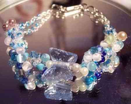 Turquoise Glass Butterfly Handwoven Bracelet that  - I made this bracelet from weaving seed beads in and out of silver plated chain, and also put a glass turquoise butterfly on it :) Very pretty. It sold on Ebay.