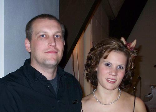 Me and my husband Chris. - This is a picture of me and my husband Chris.  The picture was taken at my little sister's wedding.  She was married one month after me:).