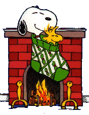 Happy Christmas - Snoopy in a Christmas Stocking hanging over the fireplace, snug and warm.