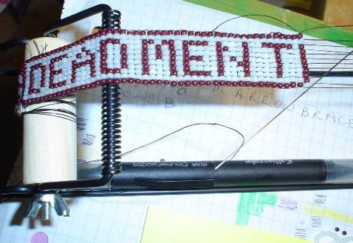 A Hatband - This is loom beading. It says 'Dead Men Tell No Tales.'