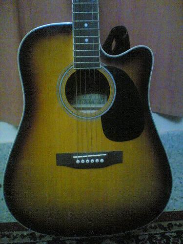Acoustic - I love my acoustic guitar.. I play it at church every sunday for mass. Practise at home everyday.. choir pracs on Sat.. N I always play at work for small office programs and for retreats at other churches..