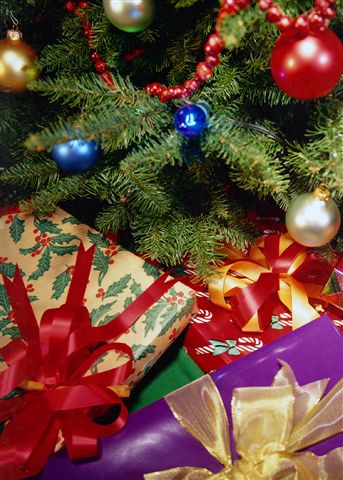 Christmas presents! - christmas presents under a christmas tree.