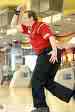 purvis granger - professional bowler Purvis Granger, bowling probably a strike in red shirt and black pants in a bowling alley