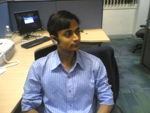 In the office - The main reason to take this picture is...the day i took this picture i was wearing a bluetooth in my ear and my girl friend wanted to see how do look in bluetooth...so i took a picture of myself and sent it to her via email.