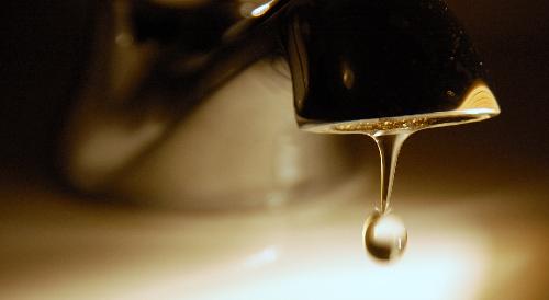Saving Water - A tap leaking water. 

Nikon D50, AF Nikkor 18-200 mm VRII