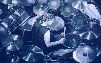 The professor on the drum kit - Worlds best drummer. Neil Peart of Rush.