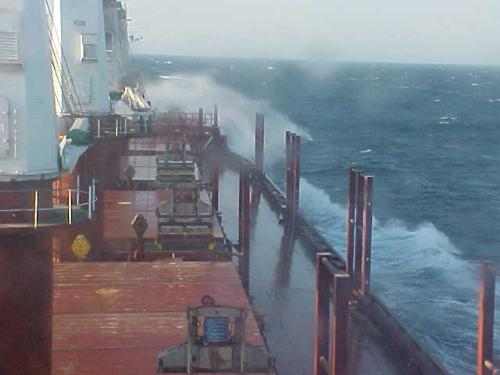 ship - You can see the sea is very rough and spraying over the ship. The wind was very strong and we were having a very bad time on board.