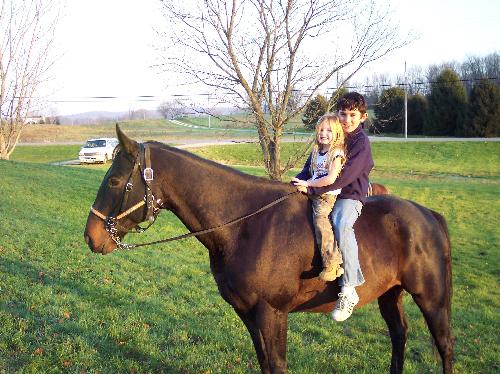 My daughter and our neighbor on my horse Ringo!! - They are having a good ride on the last nice day of the year!!