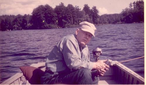 My Stepdad - Photo of my stepdad wearing his favorite railroad cap out on Lake Messalonskee, Maine fishing