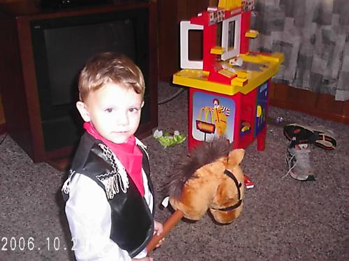 My son Tyler - This is my son Tyler dressed up has a cowboy.We don't celebrate Halloween so I let him dress up and I took pictures of him.