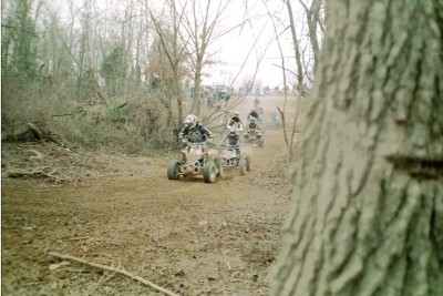 Holeshot! - In racing, whoever has the lead off the starting line has the 'holeshot'. This is a picture of my husband with the holeshot at a race in Budds Creek, Maryland.
